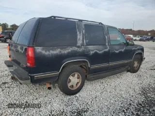 1999 GMC Yukon with VIN 1GKEC13R7XJ802387, listed as a Copart auction lot 82819934 with 438,574 mi miles and Salvage Title. Bid and sale history available at carsss.com. Image 3.