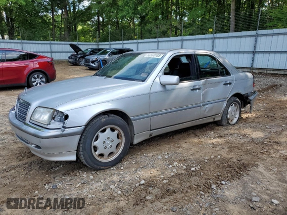 1999 Mercedes-Benz C 230/260/280/320 with VIN WDBHA24G4XA749633, listed as a Copart auction lot 56560105 with 221,306 mi miles and Salvage title. Bid and sale history available at DreamBid. Image 1.
