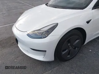 2022 Tesla Model 3 with VIN 5YJ3E1EA9NF375335, listed as a IAAI auction lot 41676024 with 18,836 mi miles. Bid and sale history available at carsss.com. Image 6.