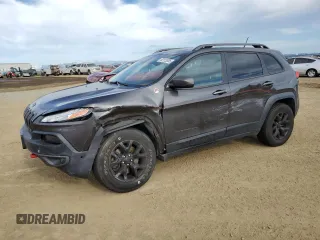 2014 Jeep Cherokee Trailhawk z VIN 1C4PJMBS1EW267783, wystawiony jako Copart lot #52113535 z przebiegiem 103 998 mil mil oraz Szkoda całkowita • Salvage title. Historia ofert i sprzedaży dostępna na DreamBid. Obrazek 1.
