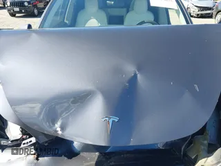 2022 Tesla Model Y Long Range with VIN 7SAYGAEEXNF381389, listed as a IAAI auction lot 41613075 with 52,800 mi miles and . Bid and sale history available at carsss.com. Image 10.