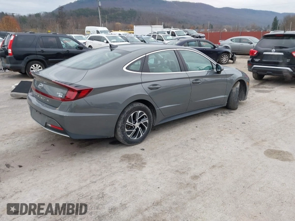 2022 Hyundai Sonata Hybrid Blue with VIN KMHL24JJ2NA048439, listed as a IAAI auction lot 40942477 with 64,855 mi miles. Bid and sale history available at carsss.com. Image 4.