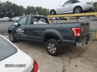 2015 Ford F-150 XL with VIN 1FTNF1EG1FKD00398, listed as a Copart auction lot 72774054 with 164,052 mi miles and Salvage title. Bid and sale history available at DreamBid. Image 2.