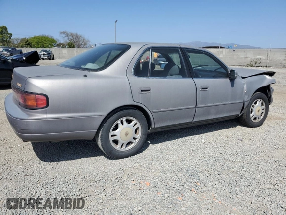 1994 Toyota Camry LE z VIN JT2GK12E6R0055565, wystawiony jako Copart lot #54031255 z przebiegiem 240 841 mil mil oraz Szkoda całkowita • Salvage title. Historia ofert i sprzedaży dostępna na DreamBid. Obrazek 3.