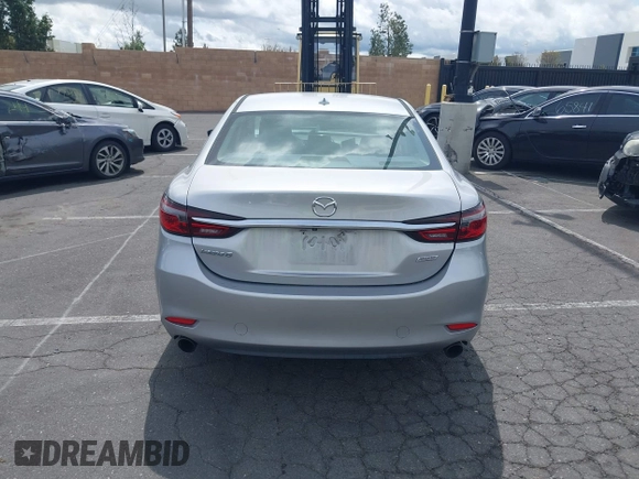 2018 Mazda 6 Grand Touring with VIN JM1GL1TY0J1306768, listed as a IAAI auction lot 41744640 with 81,798 mi miles and . Bid and sale history available at DreamBid. Image 17.