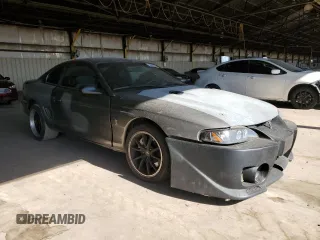 1997 Ford Mustang Cobra with VIN 1FALP47V8VF103811, listed as a Copart auction lot 56455324 with 129,499 mi miles and Salvage Title. Bid and sale history available at carsss.com. Image 4.