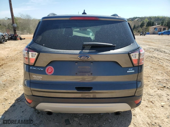 2018 Ford Escape SE with VIN 1FMCU0GD4JUD14296, listed as a Copart auction lot 50409185 with 80,700 mi miles and Salvage Title. Bid and sale history available at carsss.com. Image 6.