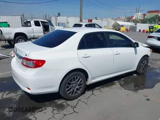 2013 Toyota Corolla L with VIN JTDBU4EE1DJ116557, listed as a IAAI auction lot 41981691 with 169,898 mi miles. Bid and sale history available at carsss.com. Image 4.