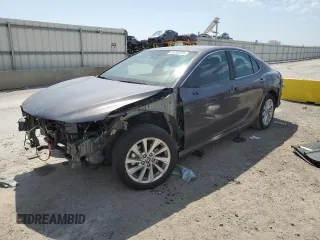 2024 Toyota Camry LE z VIN 4T1R11AK1RU877849, wystawiony jako Copart lot #53256895 z przebiegiem 10 051 mil mil oraz Szkoda całkowita • Salvage title. Historia ofert i sprzedaży dostępna na DreamBid. Obrazek 1.