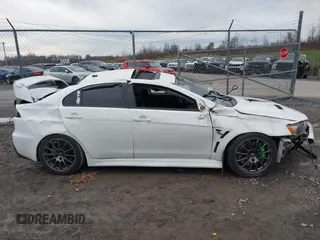 2014 Mitsubishi Lancer Evolution GSR with VIN JA32W8FV5EU012572, listed as a IAAI auction lot 40871463 with 89,529 mi miles. Bid and sale history available at carsss.com. Image 14.