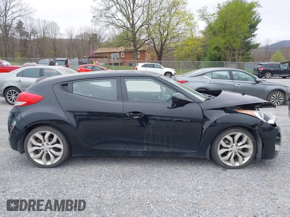 2012 Hyundai Veloster w/Gray Int z VIN KMHTC6AD6CU054422, wystawiony jako IAAI lot #41930634 z przebiegiem 144 681 mil mil oraz . Historia ofert i sprzedaży dostępna na DreamBid. Obrazek 14.