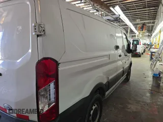 2015 Ford Transit Cargo with VIN 1FTNR1ZM3FKA55210, listed as a IAAI auction lot 42297985 with 84,545 mi miles and . Bid and sale history available at DreamBid. Image 23.