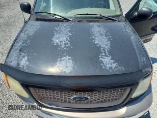 2004 Ford F-150 XL with VIN 2FTRX18W04CA13170, listed as a Copart auction lot 60932775 with 233,249 mi miles and Salvage title. Bid and sale history available at DreamBid. Image 11.