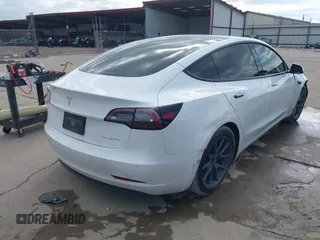 2021 Tesla Model 3 Long Range with VIN 5YJ3E1EB9MF059554, listed as a IAAI auction lot 41231520 with 63,696 mi miles and . Bid and sale history available at DreamBid. Image 4.