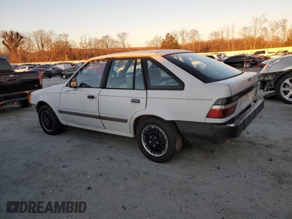 1988 Ford Escort z VIN 1FAPP959XJW370611, wystawiony jako Copart lot #86715994 z przebiegiem 3424 mil mil oraz Tytuł czysty. Historia ofert i sprzedaży dostępna na DreamBid. Obrazek 2.