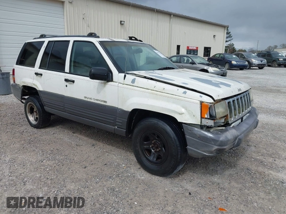 1996 Jeep Grand Cherokee Laredo with VIN 1J4FX58S1TC278511, listed as a IAAI auction lot 41837339 with 303,947 mi miles. Bid and sale history available at carsss.com. Image 1.