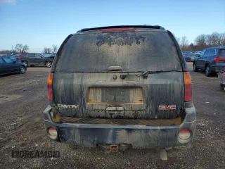 2005 GMC Envoy SLT with VIN 1GKDT13S552310799, listed as a Copart auction lot 43586125 with 182,928 mi miles and Salvage Title. Bid and sale history available at carsss.com. Image 6.