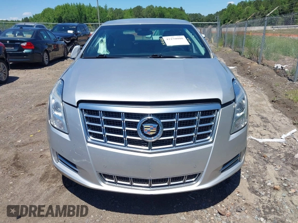 2014 Cadillac XTS Luxury z VIN 2G61M5S31E9199170, wystawiony jako IAAI lot #42150000 z przebiegiem 135 414 mil mil oraz . Historia ofert i sprzedaży dostępna na DreamBid. Obrazek 12.