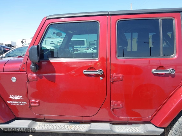 2011 Jeep Wrangler Unlimited Sahara with VIN 1J4BA5H15BL557871, listed as a IAAI auction lot 41922328 with 206,581 mi miles. Bid and sale history available at carsss.com. Image 15.