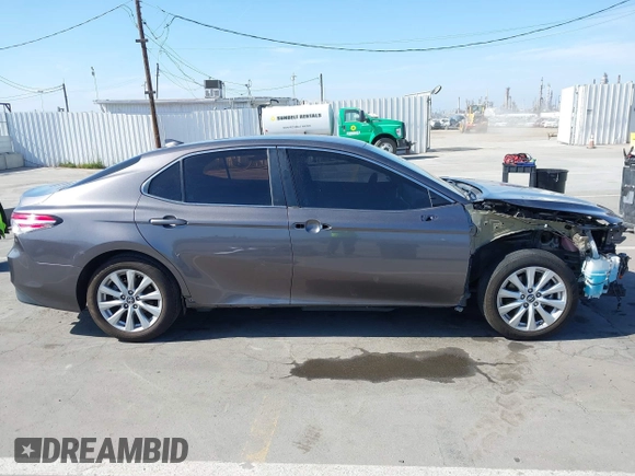2019 Toyota Camry LE with VIN 4T1B11HK2KU240465, listed as a IAAI auction lot 42095075 with 67,852 mi miles and . Bid and sale history available at DreamBid. Image 14.