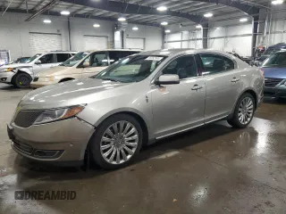 2016 Lincoln MKS z VIN 1LNHL9DK3GG600907, wystawiony jako Copart lot #56892995 z przebiegiem 122 220 mil mil oraz Szkoda całkowita • Salvage title. Historia ofert i sprzedaży dostępna na DreamBid. Obrazek 1.