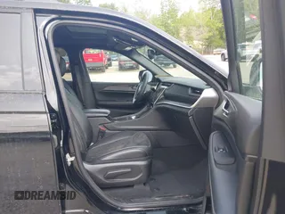 2023 Jeep Grand Cherokee Laredo with VIN 1C4RJHAG2PC660094, listed as a IAAI auction lot 42390290 with 27,802 mi miles and . Bid and sale history available at DreamBid. Image 5.