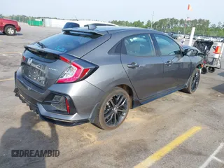 2021 Honda Civic Sport with VIN SHHFK7H44MU217741, listed as a IAAI auction lot 42029373 with 68,572 mi miles and . Bid and sale history available at DreamBid. Image 4.