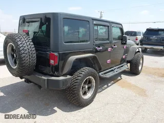 2013 Jeep Wrangler Unlimited Sport with VIN 1C4BJWDG9DL569109, listed as a IAAI auction lot 42115703 with 120,803 mi miles. Bid and sale history available at carsss.com. Image 4.