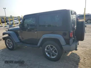 2009 Jeep Wrangler X with VIN 1J4FA24159L772540, listed as a Copart auction lot 62183815 with 179,628 mi miles and Salvage title. Bid and sale history available at DreamBid. Image 2.