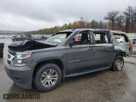 2018 Chevrolet Suburban LT z VIN 1GNSKHKC9JR262273, wystawiony jako Copart lot #51970175 z przebiegiem Nie podano mil oraz Szkoda całkowita • Salvage title. Historia ofert i sprzedaży dostępna na DreamBid. Obrazek 1.