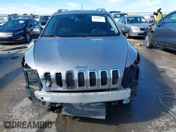 2015 Jeep Cherokee Latitude with VIN 1C4PJLCB8FW620336, listed as a IAAI auction lot 41634997 with 130,335 mi miles. Bid and sale history available at carsss.com. Image 13.