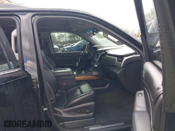 2015 Chevrolet Suburban LTZ with VIN 1GNSKKKC5FR255373, listed as a IAAI auction lot 42012528 with 219,030 mi miles and . Bid and sale history available at DreamBid. Image 5.