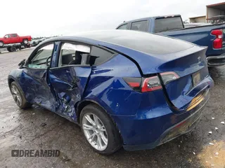 2023 Tesla Model Y Long Range with VIN 7SAYGDEE7PF673988, listed as a IAAI auction lot 41057651 with 29,683 mi miles and . Bid and sale history available at DreamBid. Image 3.