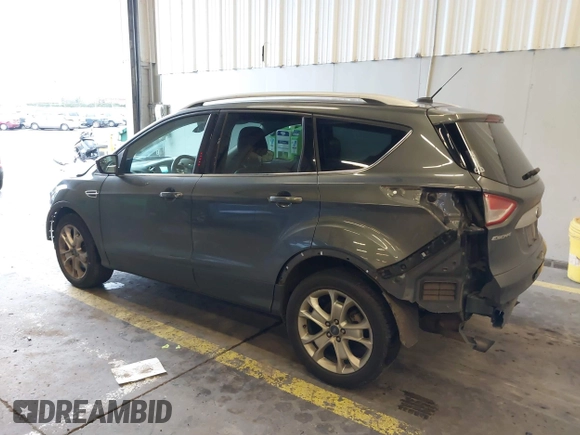 2016 Ford Escape Titanium with VIN 1FMCU9J92GUB63525, listed as a IAAI auction lot 41469824 with 156,773 mi miles. Bid and sale history available at carsss.com. Image 3.