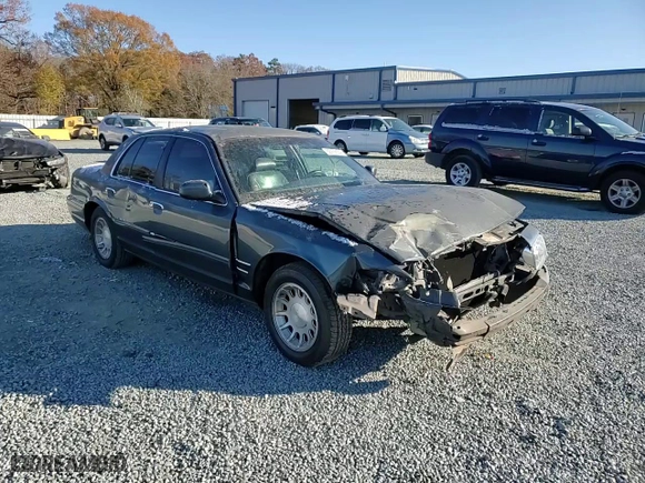 1999 Ford Crown Victoria LX with VIN 2FAFP74W9XX137078, listed as a Copart auction lot 82999554 with 166,132 mi miles and Salvage Title. Bid and sale history available at carsss.com. Image 10.