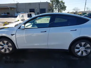 2022 Tesla Model Y Long Range with VIN 7SAYGDEE1NF402745, listed as a IAAI auction lot 41493850 with 11,222 mi miles and . Bid and sale history available at DreamBid. Image 14.