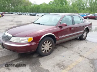 2000 Lincoln Continental with VIN 1LNHM97V5YY845447, listed as a IAAI auction lot 42077417 with 83,655 mi miles. Bid and sale history available at carsss.com. Image 2.