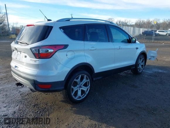 2017 Ford Escape Titanium with VIN 1FMCU9J98HUA04994, listed as a IAAI auction lot 41139988 with 136,989 mi miles. Bid and sale history available at carsss.com. Image 4.