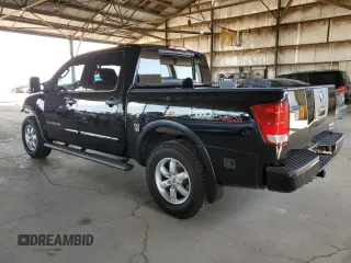 2011 Nissan Titan Pro-4X z VIN 1N6BA0EC9BN304469, wystawiony jako Copart lot #52982815 z przebiegiem 108 829 mil mil oraz Szkoda całkowita • Salvage title. Historia ofert i sprzedaży dostępna na DreamBid. Obrazek 2.