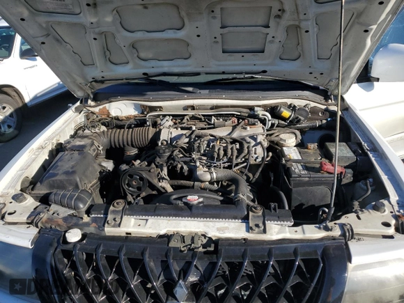 2003 Mitsubishi Montero z VIN JA4MT41RX3J013246, wystawiony jako Copart lot #42210545 z przebiegiem 188 387 mil mil oraz Szkoda całkowita • Salvage title. Historia ofert i sprzedaży dostępna na DreamBid. Obrazek 11.