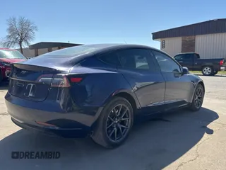 2023 Tesla Model 3 Long Range with VIN 5YJ3E1EB1PF625677, listed as a Copart auction lot 52424245 with 12,817 mi miles and Salvage Title. Bid and sale history available at DreamBid. Image 4.