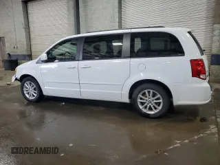 2014 Dodge Grand Caravan SXT with VIN 2C4RDGCG6ER427435, listed as a Copart auction lot 51957355 with 106,078 mi miles and Salvage Title. Bid and sale history available at DreamBid. Image 2.