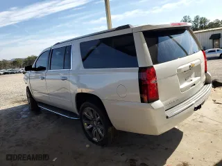 2020 Chevrolet Suburban Premier with VIN 1GNSKJKC0LR276184, listed as a Copart auction lot 88840565 with 87,563 mi miles and Salvage Title. Bid and sale history available at carsss.com. Image 2.