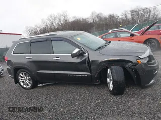 2015 Jeep Grand Cherokee Summit with VIN 1C4RJFJM6FC955904, listed as a IAAI auction lot 41483446 with 65,970 mi miles. Bid and sale history available at carsss.com. Image 14.