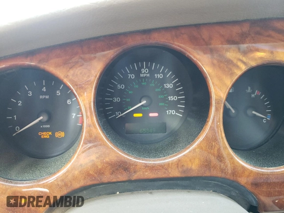 1999 Jaguar XK with VIN SAJGX2043XC040866, listed as a Copart auction lot 53712555 with 65,349 mi miles and Clean Title. Bid and sale history available at DreamBid. Image 9.