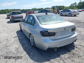2013 BMW 3 Series 328i with VIN WBA3A5C57DF356069, listed as a IAAI auction lot 42078635 with 140,669 mi miles. Bid and sale history available at carsss.com. Image 3.