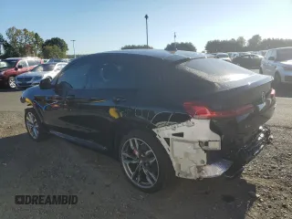 2021 BMW X4 M40i with VIN 5UX2V5C05M9H59295, listed as a Copart auction lot 71312963 with 31,050 mi miles. Bid and sale history available at carsss.com. Image 2.