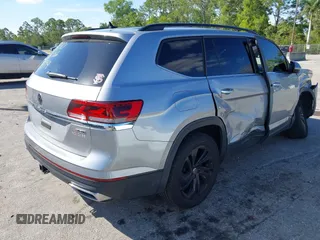 2022 Volkswagen Atlas SE z VIN 1V2HR2CA9NC518394, wystawiony jako IAAI lot #41702134 z przebiegiem 28 685 mil mil oraz . Historia ofert i sprzedaży dostępna na DreamBid. Obrazek 4.