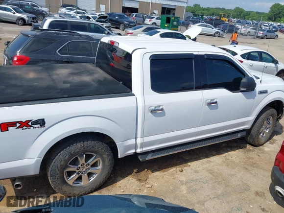 2018 Ford F-150 XL with VIN 1FTEW1EP9JKE58173, listed as a IAAI auction lot 42389998 with 129,512 mi miles and . Bid and sale history available at DreamBid. Image 14.