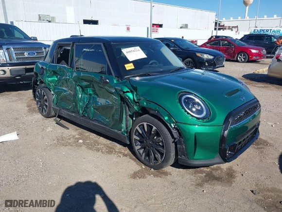 2024 MINI Hardtop 4 Door Cooper S with VIN WMW53DK01R2V69200, listed as a IAAI auction lot 40854234 with 6716 miles. Bid and sale history available at carsss.com. Image 1.